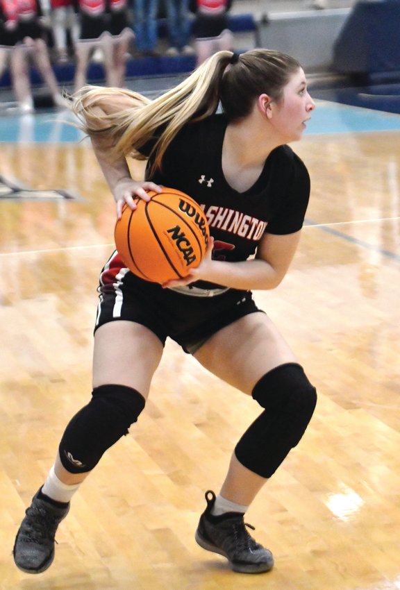 Washington senior Kyndall Wells handles the ball for the Warriors during their 63-49 win over Luther in the Area championship. Wells scored 14 points in the game. The Warriors play Silo at 7:30 p.m. today (Thursday) at the Big House on the State Fairgrounds.