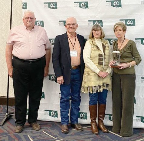 When Purcell&rsquo;s Patti Christian was honored as the State Employee of the Year at the Oklahoma Association of Conservation Districts at their annual banquet recently in Edmond she was joined by family and McClain County Board Members, from left, Jeff Staggs, Everett Wollenberg and Jo White.