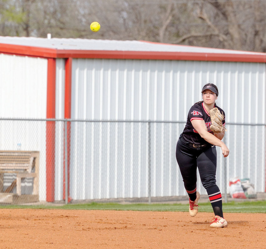 Washington senior Elly Allison fields a ball and throws it to first base for an out. Allison and the Warriors play host today (Thursday) as the Washington softball tournament opens at home at 11 a.m.