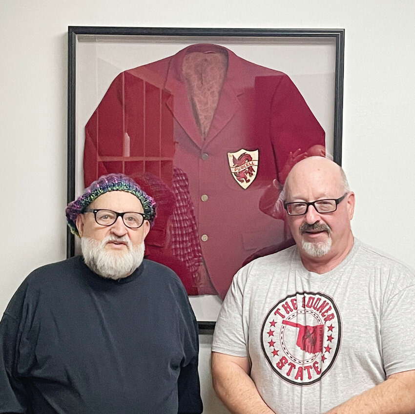 Dick Gray, alongside his brother Kurt, recently loaned his vintage Purcell Dragons sport coat to Purcell High School to display to the public.