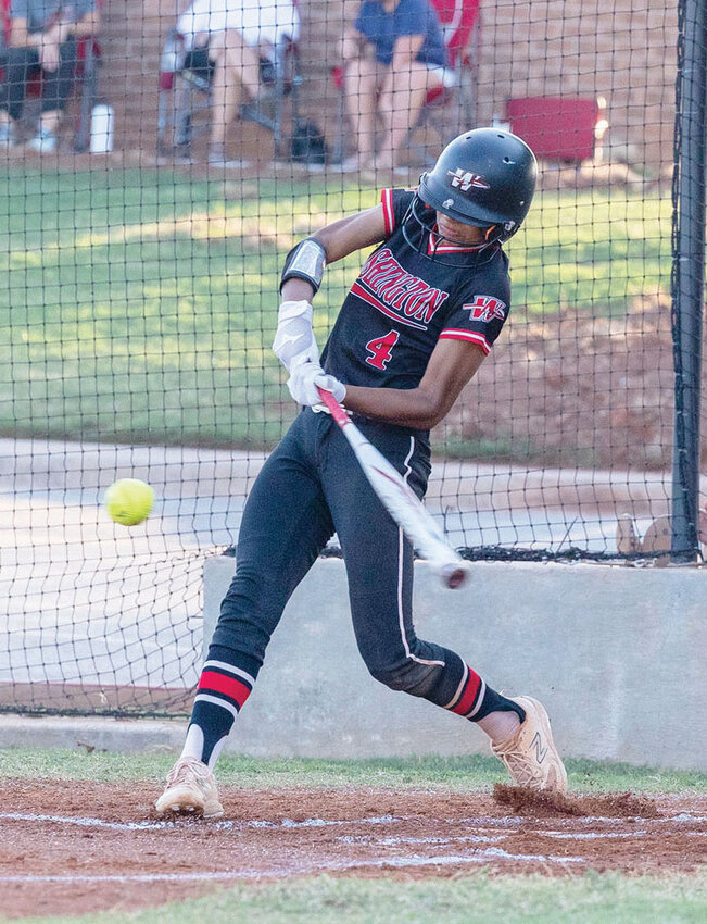 Washington freshman Ava Salcedo connects with a ball during the Warriors&rsquo; 8-7 win over Cache during the Heart of Oklahoma Softball Tournament. Salcedo was 2-4 with a double from her leadoff spot.