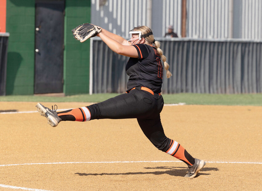 Lexington sophomore Hannah Garrett goes home with a pitch for the Bulldogs fast-pitch softball team. Garrett pitched a four-inning shutout against Madill last Thursday in the Bulldogs&rsquo; 10-0 win.