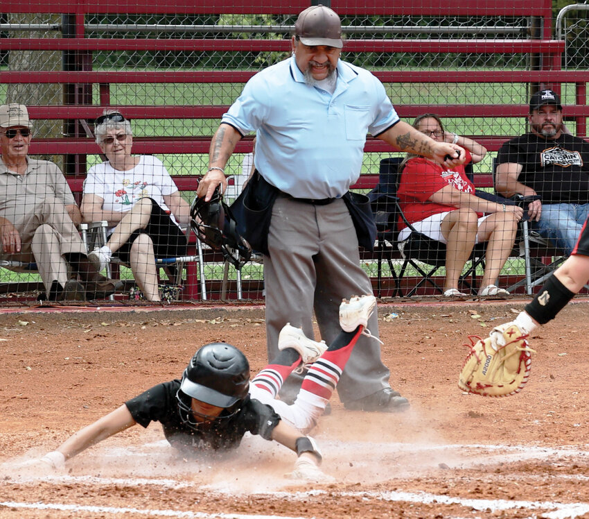 Purcell senior Payci Constant safely slides into home on a bunt during the Dragons&rsquo; 12-0 win over Pauls Valley. Purcell hosts Perkins-Tryon and Anadarko in the Regional tournament this week.