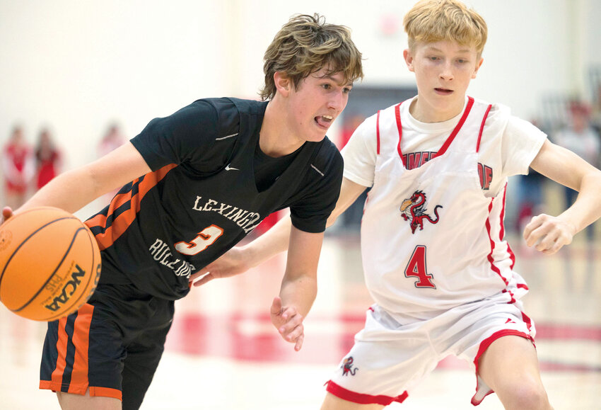 Lexington senior Ty Mixon (3) dribbles while Purcell sophomore Ryder Ward (4) guards him during the Dragons&rsquo; 71-60 win. Mixon had 19 points while Ward scored two.