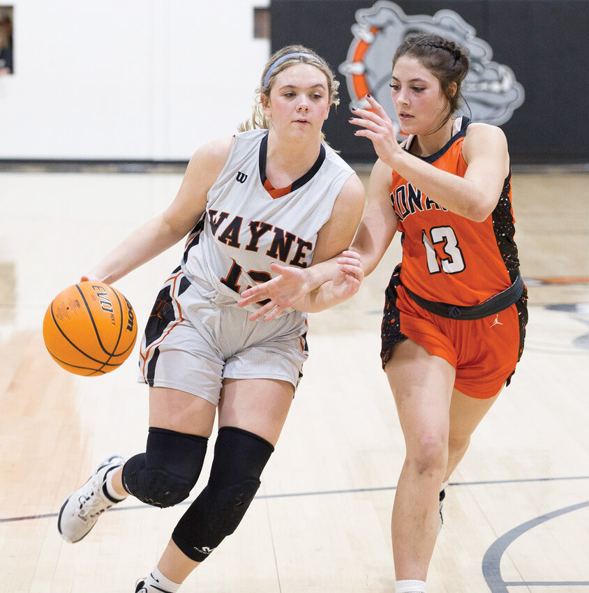 Wayne freshman Taelyn Ringwald dribbles around a Konawa defender during the Bulldogs&rsquo; 46-33 win over the Tigers. Ringwald scored 20 points in the game.