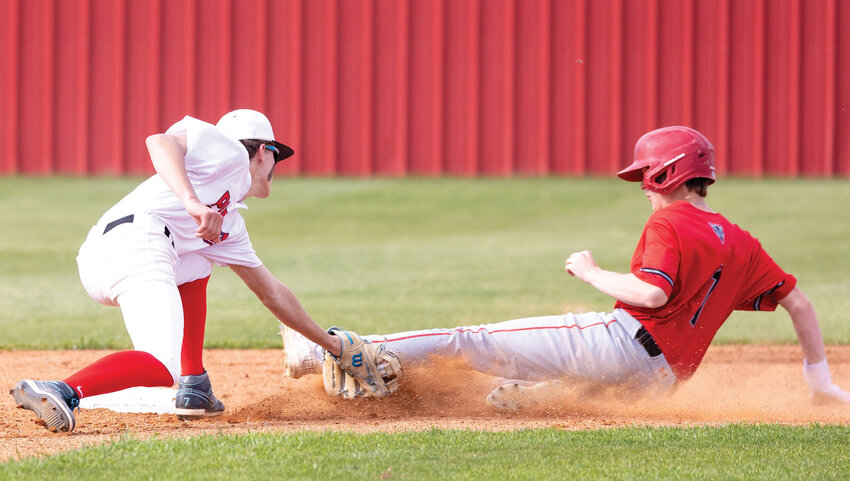 Purcell sophomore Deaken Dobbins slaps a tag on a Vanoss base runner during the Dragons&rsquo; 10-1 win. Purcell played error-free baseball on defense in the game.