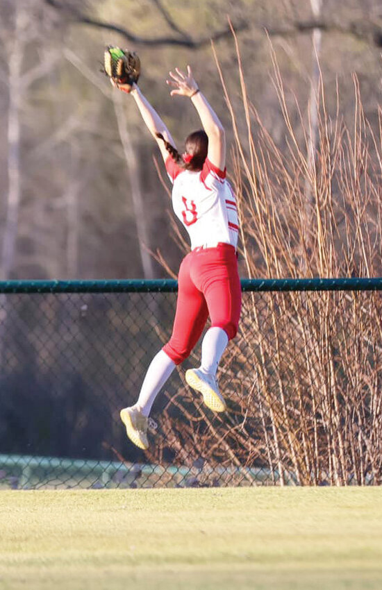 With some major ups, Washington freshman Daphne Palumbo robbed a hitter of a home run in a recent softball game.