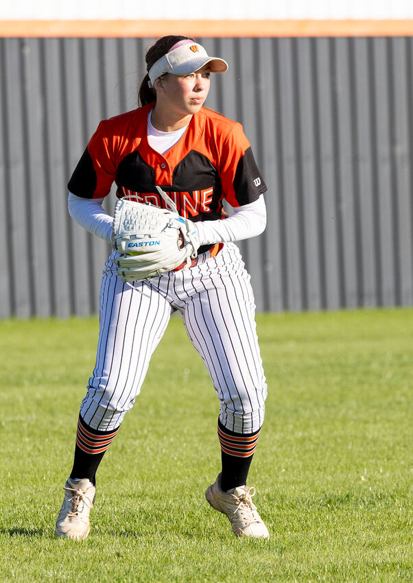 Wayne senior Faith Brazell knows where her runners are as she readies to throw the ball in recent slow-pitch action. The Lady Bulldogs were hosting Savanna and Stratford for the District tournament on Wednesday.