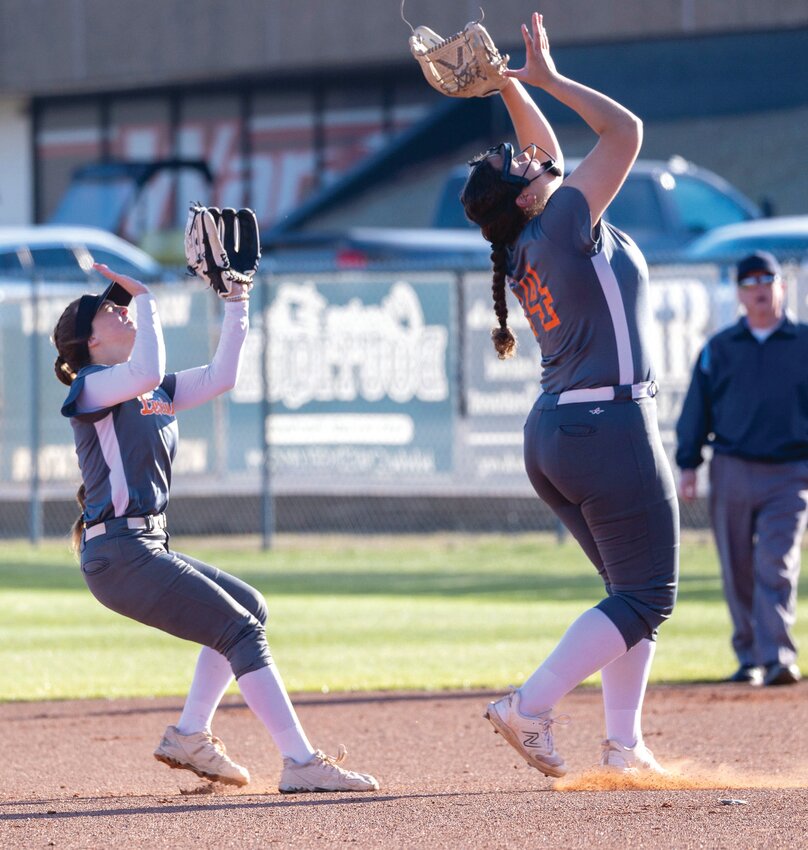 Lexington seniors Marisa Northrup and Kiely Givens track a fly ball in the infield for the Bulldogs. Lexington&rsquo;s season ended after they lost 11-5 and 8-7 to Tishomingo.