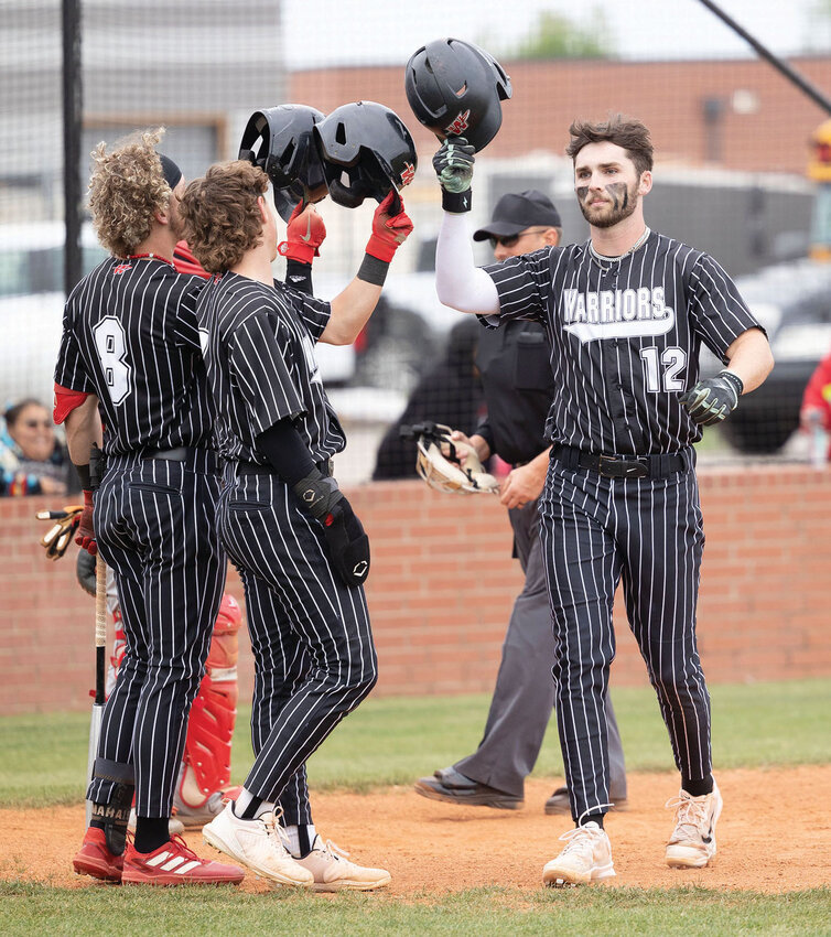 Washington senior Dax McCaskill celebrates after one of his two home runs during the Warriors’ 15-0 win over Riverside.