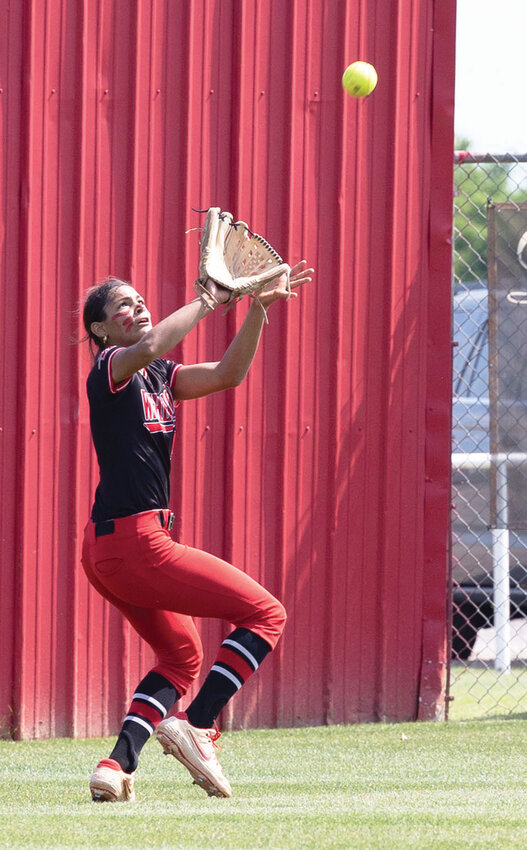 Washington freshman Ava Salcedo puts radar lock on a fly ball in the outfield during the Regional softball tournament. The Warriors defeated Stilwell 9-0 and Perkins-Tryon 11-1 to advance to the State tournament.