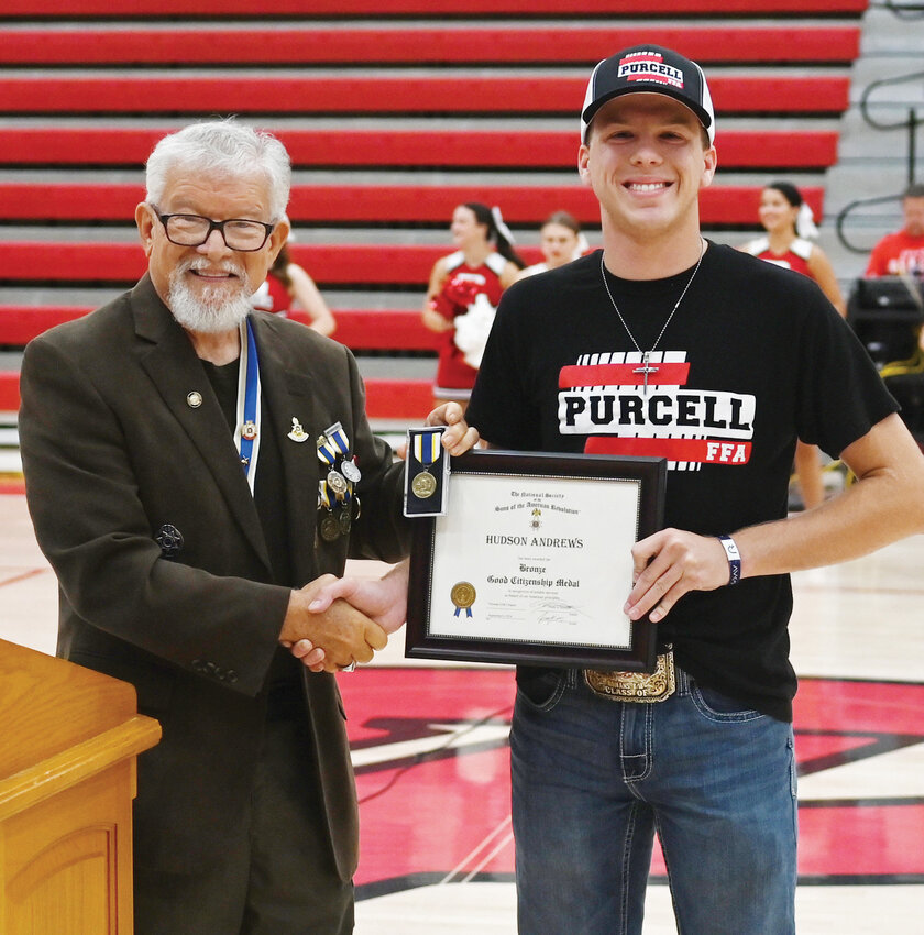 Purcell senior Hudson Andrews (right) was awarded the Bronze Sons of the American Revolution Good Citizenship certificate and medal Friday during the high school pep assembly. Presenting the award was Mark Atterson, President of the Norman Chapter of the Sons of the American Revolution.