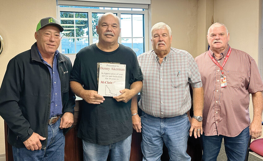 County commissioners Glen Murray, Wilson Lyles and Terry Daniel last week honored retiring McClain County Courthouse custodian Benny Akerman with a retirement ceremony.