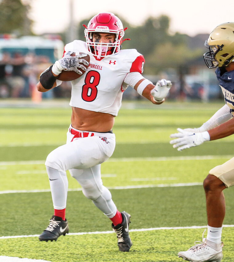 Purcell senior Noel Chavez tries to get to the corner Friday night during the Dragons’ game against Kingfisher. Purcell fell 26-13.