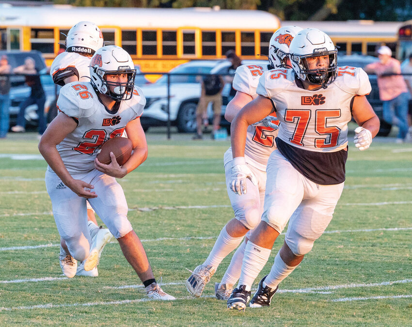 Lexington junior Cameron Weatherford (26) has blockers out front as he carries the ball. The Bulldogs travel to Crossing Thursday night.