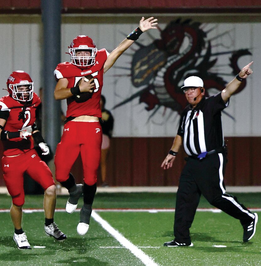 Purcell senior Christian Kirk declares Dragon ball after he recovered a fumble Friday night against Anadarko. Purcell fell to the Warriors 45-42 in a turnover-plagued game.