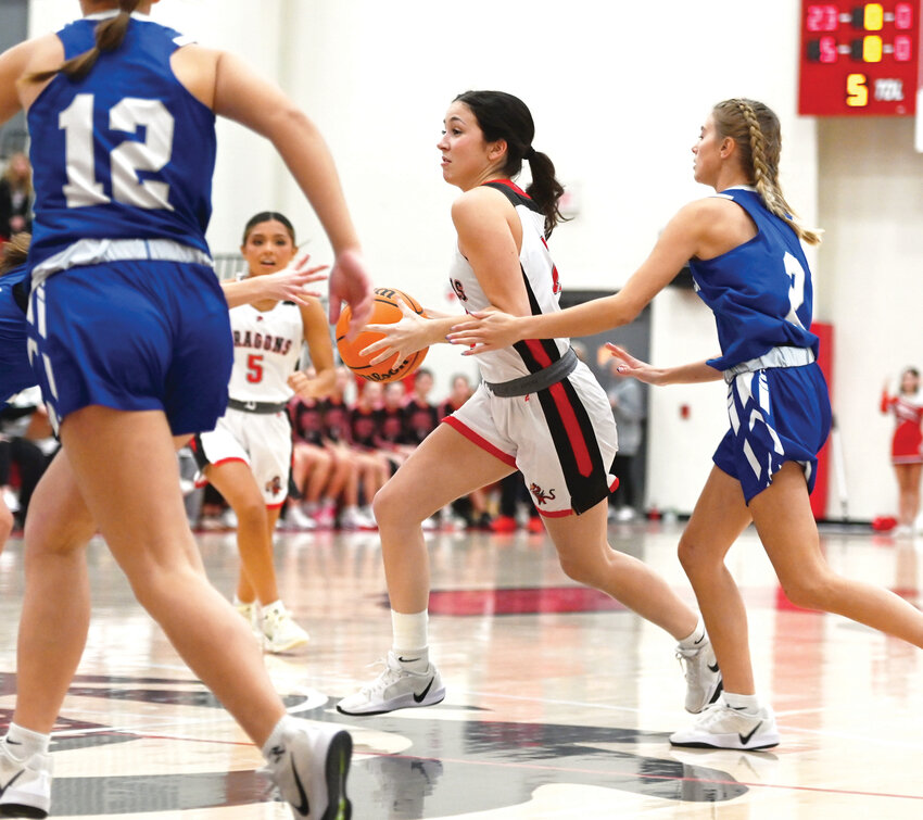Purcell senior Haven Buchanan takes the ball to the hoop during the Dragons&rsquo; game against Bridge Creek. Purcell won 60-18. Buchanan scored three points in the game.