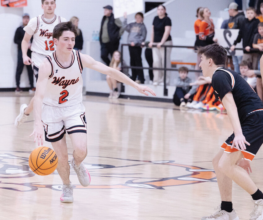 Wayne junior Ben Fisher dribbles the ball up the floor against Maud during the Bulldogs&rsquo; 63-43 win. Fisher scored 13 points in the game.