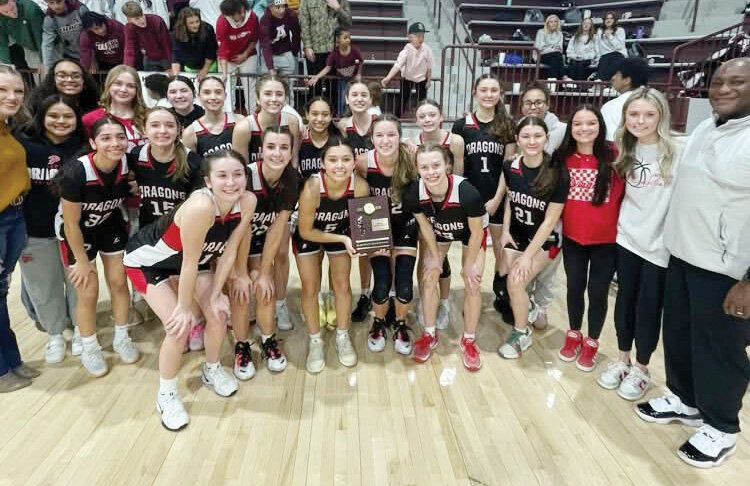 The Purcell girls basketball team defeated Ada 66-56 to claim the District title Friday night. They advance to play McLoud tonight (Thursday) at 6 p.m. at McLoud in the Regional tournament. Pictured are assistant coach Mandy Clay, Kami Alamos, Bri Wren, Lili Del Toro, Taylor Leggett, Isa Walker, Halle Madden, Avery Hines, Halle Buchanan, Lync Harding, Taygan Winters, Parker Lovett, Kaylee Peoples, Rylee Peoples, Aubrey Elmore, Emma Renfro and head coach Toney Cooper. On the front are seniors Haven Buchanan, Hannah Whitaker, Kenna Esparza, Tinley Winters, Hadleigh Harp.