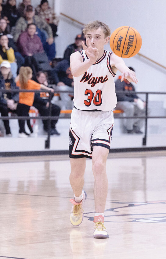 Wayne freshman Brody Kemp passes the ball in the Bulldog offense. Wayne was defeated 84-75 by Stonewall, ending their season.