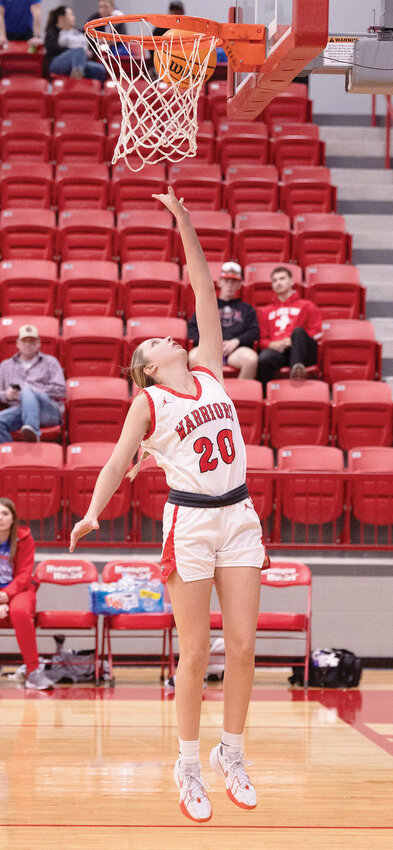 Washington freshman Briley Beller puts up a two-point bucket for the Warriors. Beller had a big game against Anadarko in the Area tournament, scoring nine points. Washington will play Roland today (Thursday) in the Big House at the State Fairgrounds at 4:30 p.m. in the State tournament.
