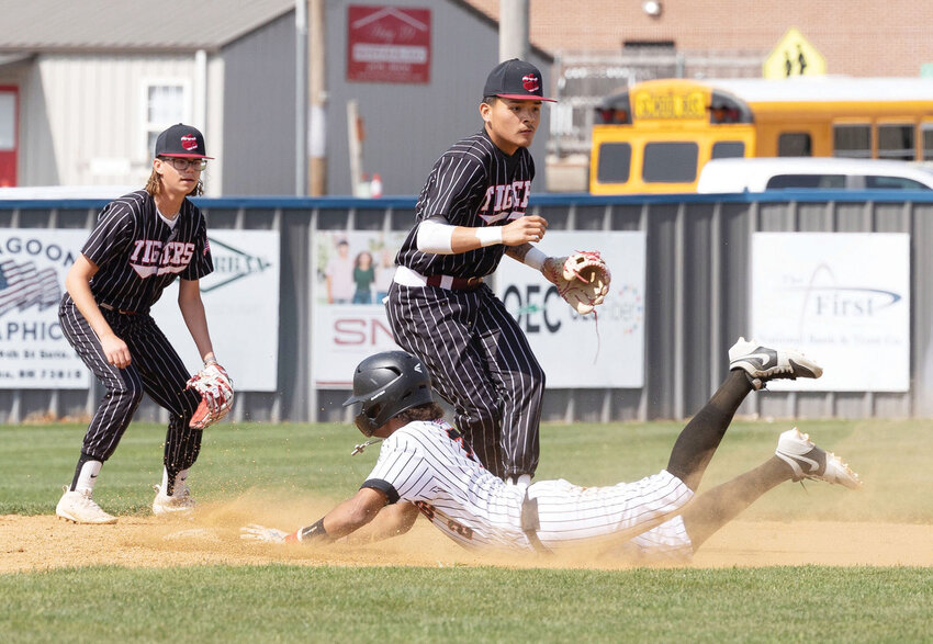 Lexington freshman Cody Rollins slides into second in the Bulldogs&rsquo; 7-5 win over Ardmore in the Dibble tournament last week. Rollins had a hit in the game.