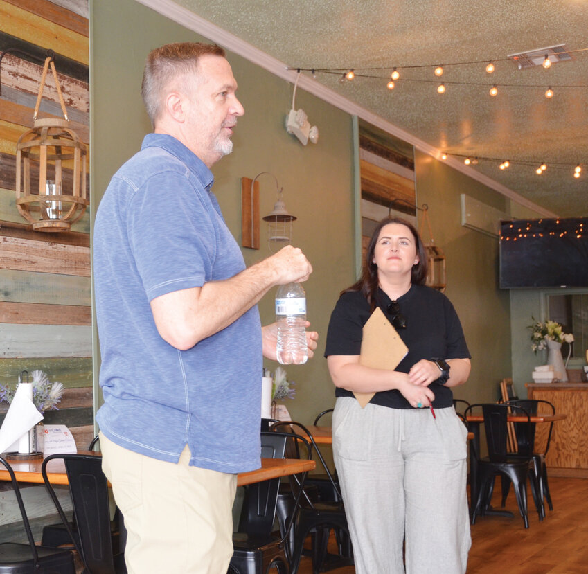 Purcell Mayor Graham Fishburn gave an informational address at the Heart of Oklahoma and First United Bank’s evening with the mayor at Happy Camper last Thursday evening while Chamber Executive Director Elisabeth Baker looked on.