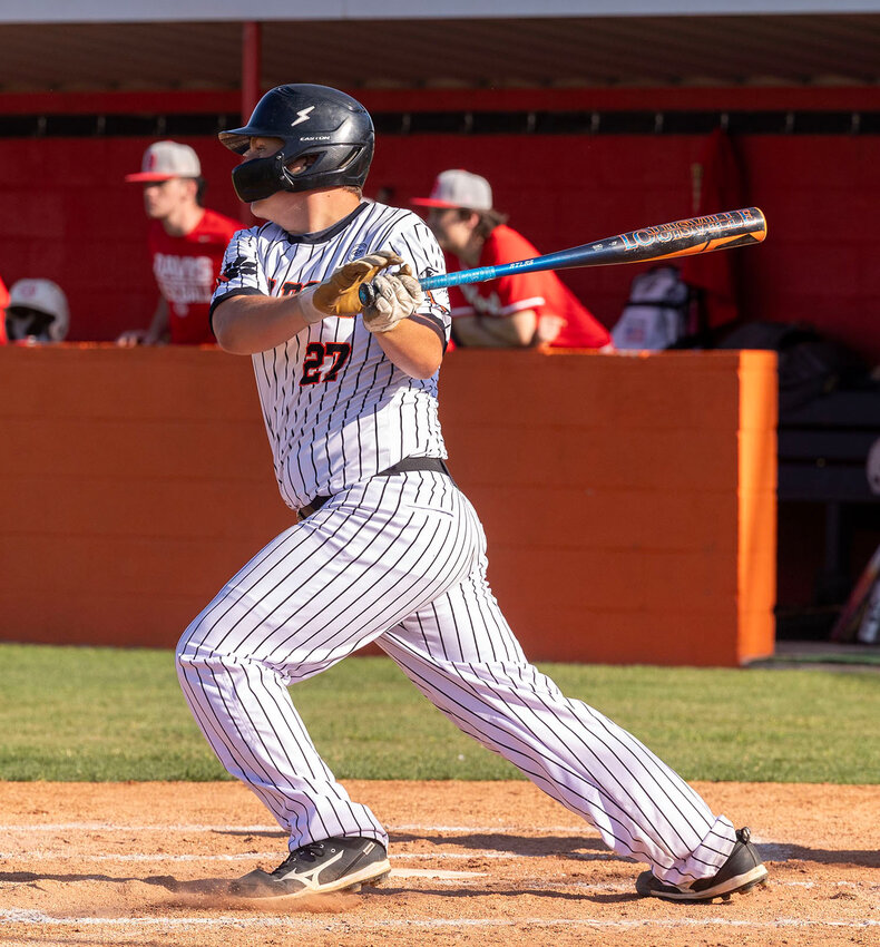 Lexington senior Ryan Johnson connects with a ball during the Bulldogs&rsquo; game against Davis. Lexington fell 13-1.