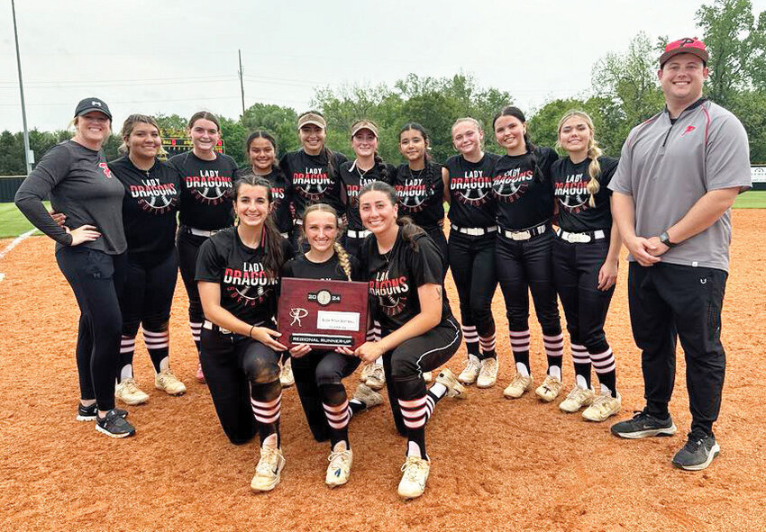 The Purcell slow-pitch softball team defeated Chandler (4-2) and Bethel (3-2) to claim Regional runners-up and advance to the State tournament in Shawnee at the Ballfields at FireLake. They will play Tuesday. Pictured are, from front left, seniors Hannah Whitaker, Anika Raper and Ella Resendiz. In the back are, from left, head coach Sarah Jones, Miaca Martinez, Ava Sparks, Kami Rendon, KK Vazquez, Jasey Baker, Alexis Jurado, Kendra Anderson, Mack McKay, Chloe Morrow, and assistant coach Ethan Scott.