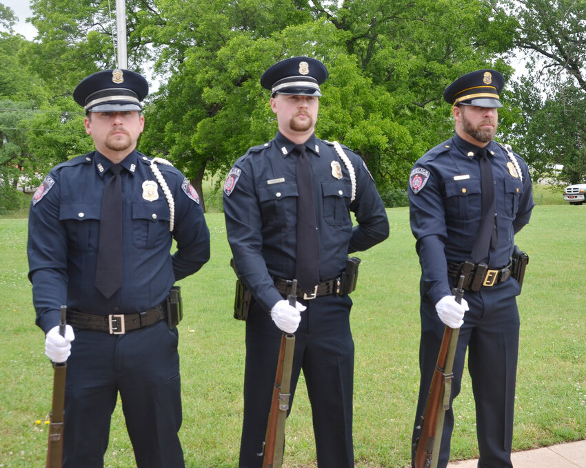Providing a gun salute during the annual Purcell Memorial Day service at the Multi-Purpose Building were members of the Purcell Police Department. From left are Det. Jeremy Pittman, Officer Jacob Martz and Sgt. Kyle Mobley.