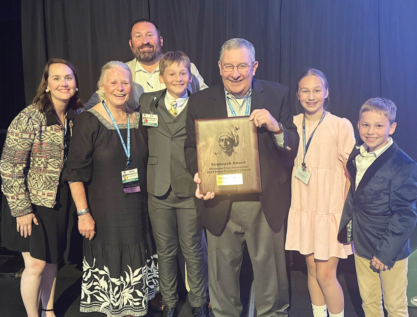 Purcell Montgomerys accepted the Sequoyah plaque last Saturday night winning division 5 of the Sweepstakes newspaper contest at the Grand Casino Hotel and Resort in Shawnee during the annual Oklahoma Press Association’s Awards Banquet. From left are Emily, Gracie, John Denny, Jack, John D., Lane and Thomas Montgomery.