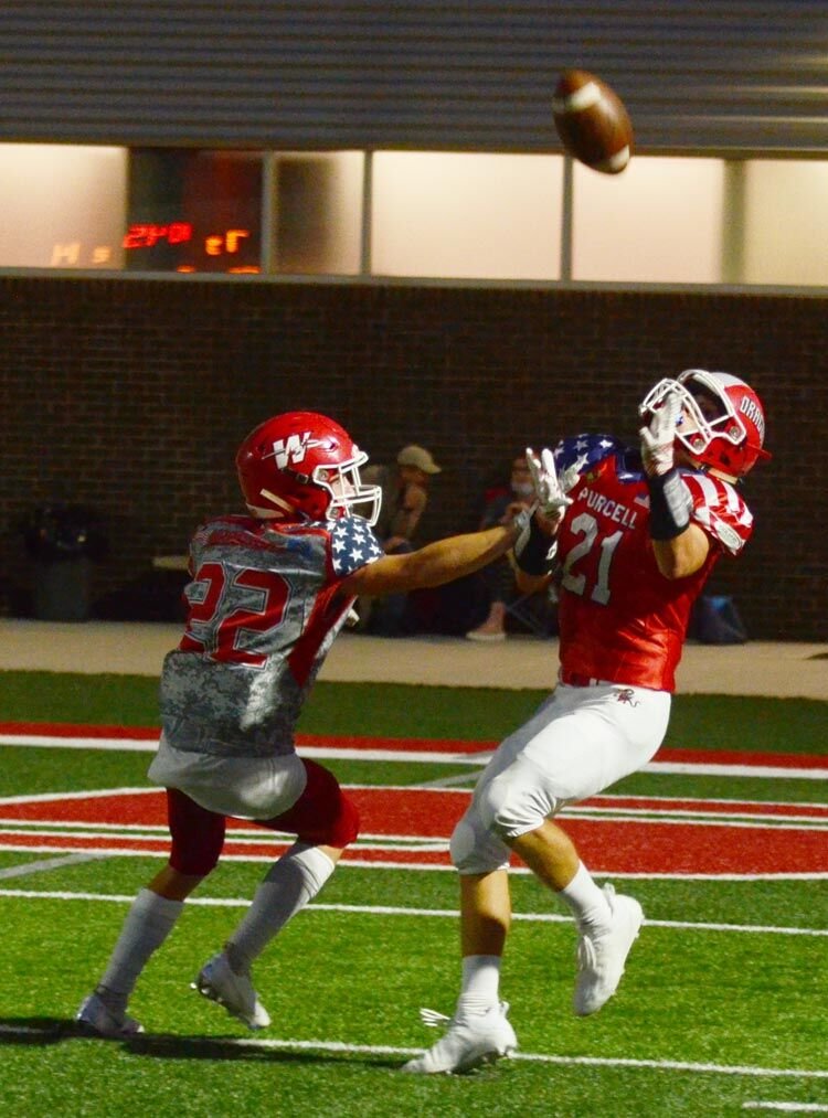 Titus Mason makes a tough catch along the boundary to get the Dragons into the Red Zone Friday night.