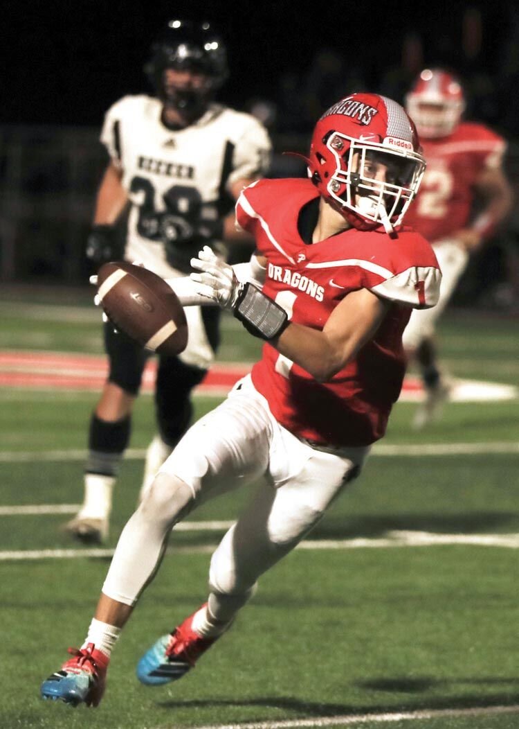 Mojo Browning picks up part of his 174 receiving yards against Meeker Friday night. Browning also had a pick six in the game. The Dragons were defeated 25-24 by the Bulldogs.