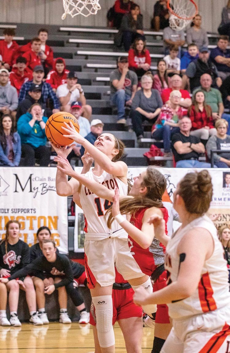Emilee Jenks fights for a rebound this past season against Purcell. She averaged 10.2 points per game along with eight rebounds and 2.8 assists per game as a senior at Lexington.