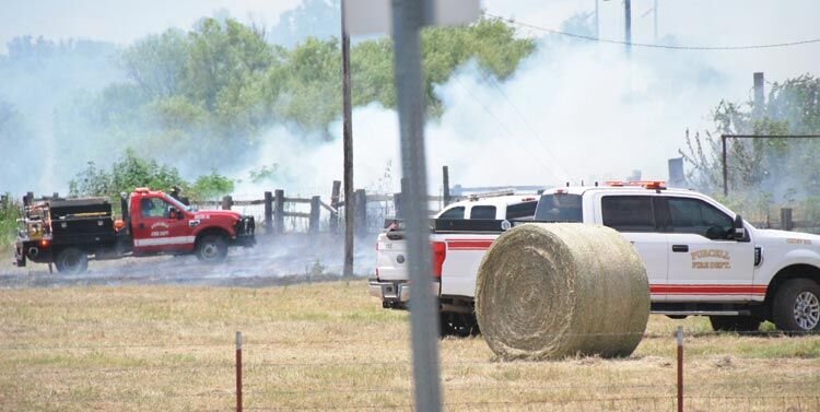 Drying grass and giant round bales of hay made for fuel for a good sized grass fire just after 1 p.m. Tuesday at Hardcastle Blvd. and Wyatt Road, just west of the Chickasaw Nation Area Office.