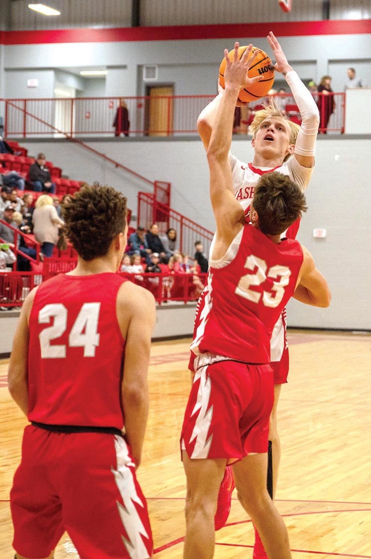 Luke Hendrix pulls up for a jumper during Washington’s 59-56 win over Purcell. Hendrix scored six points.