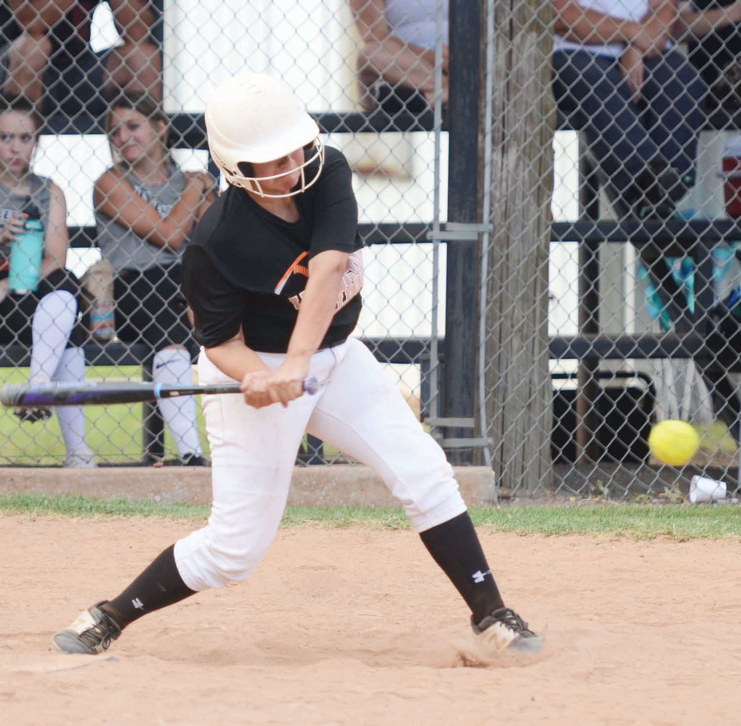 Lexington junior Cora Vazquez pounds a ball to the outfield. Vazquez and the Bulldogs will play in the Roff tournament today (Thursday) through Saturday.