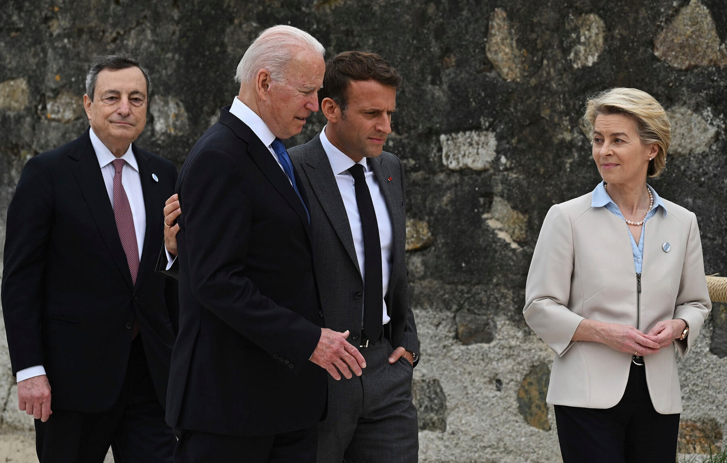 From left, Italian Prime Minister Mario Draghi, US President Joe Biden, President of France, Emmanuel Macron and European Commission Ursula von der Leyen speak after posing for photos for the Leaders official welcome and group photo session, during the G7 Summit, in Carbis Bay, Cornwall, England, Friday, June 11, 2021.