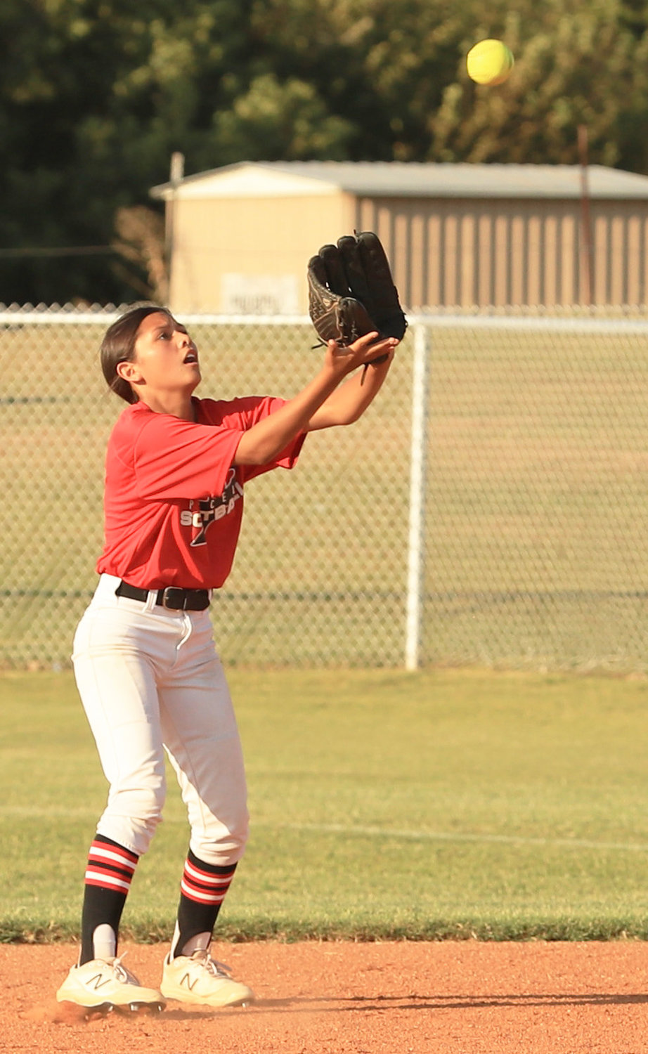 Purcell freshman Kenna Esparza settles under a ball for an out Monday during the Dragons’ 4-3 win over Little Axe.