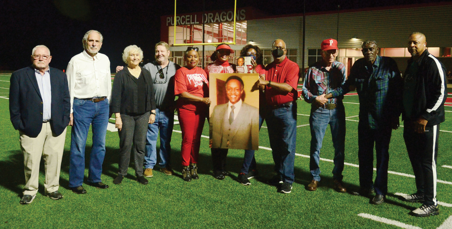 The 2021 Purcell Sports Hall of Fame class was honored at halftime of the Purcell-CHA football game in front of a homecoming crowd Friday night. Pictured are newly inducted members, Bruce James, Richard Lemler, Peck Martin, Vernon Bass, James Bell, Herman Cheadle, Connie Wells, Rose Mantooth, Tom Smith Sr., Harold Simeroth, Bill “Trojan” Simeroth and Joe and Marilyn Ellis and their family representatives.