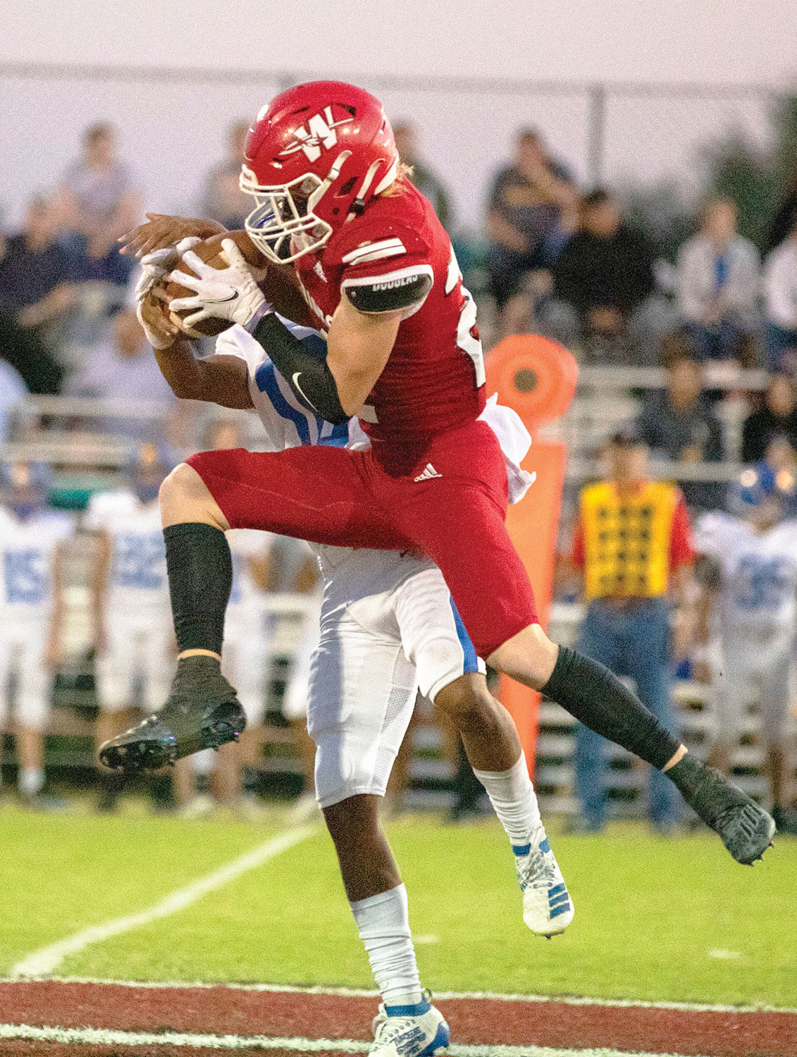Washington senior Reese Stephens picks off a Holdenville pass during the Warriors’ 69-0 win over the Wolverines. The interception was one of eight on the night.