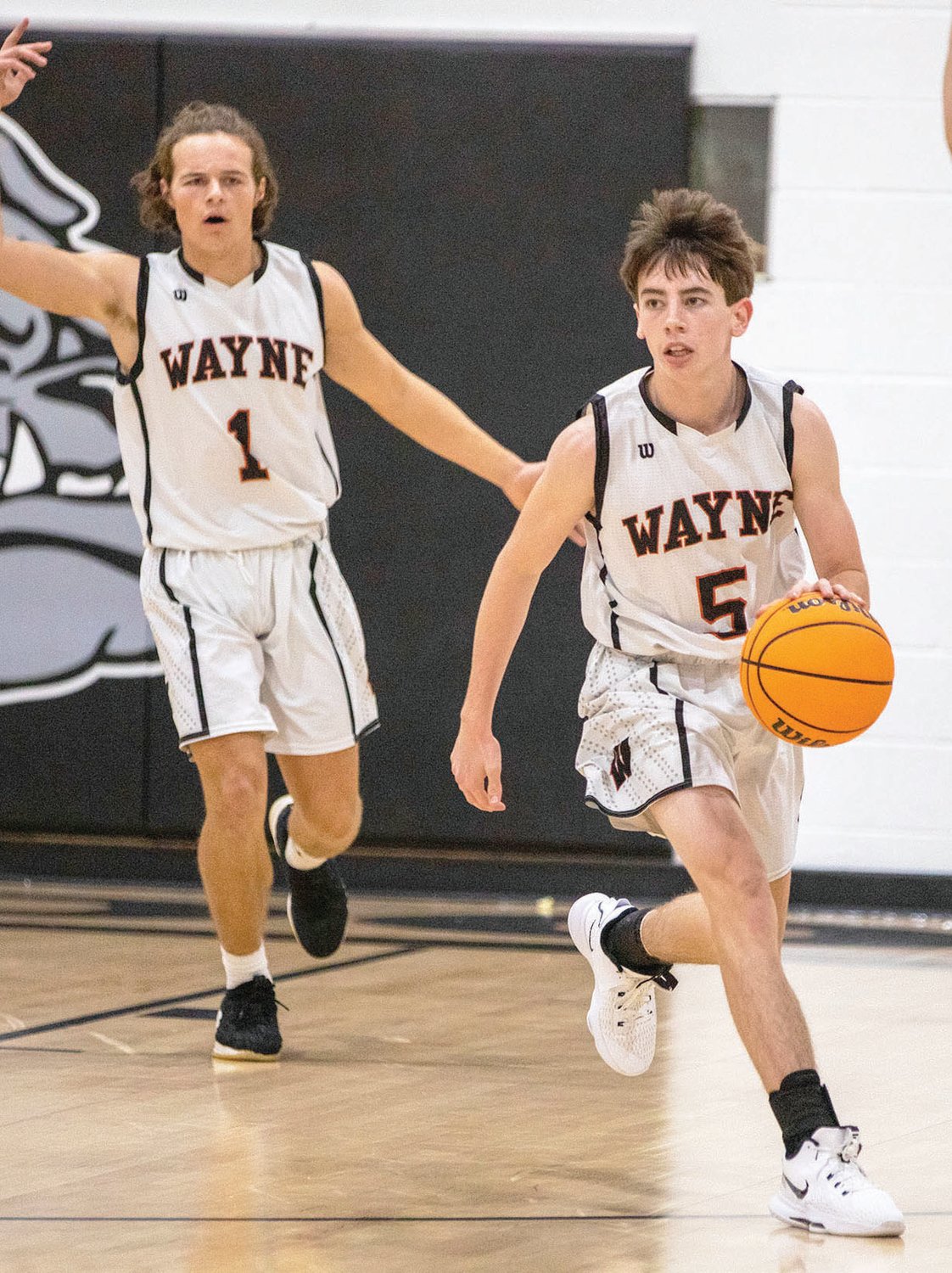 Wayne ballers Kaleb Madden (5) and Ethan Mullins (1) move the ball down court for the Bulldogs. Wayne is scheduled to host Konawa Friday night.