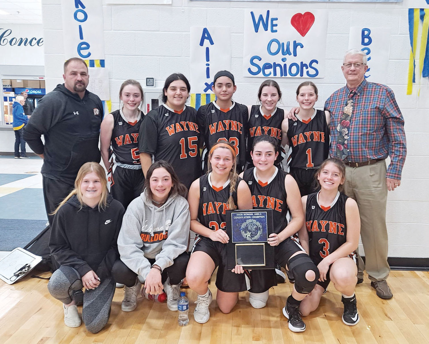 The Wayne Lady Bulldogs beat Empire 35-26 to win the Consolation in the Stephens County tournament last week. Pictured, in front, from left are Madi Self, Faith Brazell, Haiden Parker, Daliyah Fuentes and Jordynn Debaets. In the back, from left, are coach Charles Durrence, McKenzie Fisher, Mayce Trejo, Lorensa Martinez, Kaylee Madden, Haylee Durrence and head coach Bill Burnett. Full story on page 2B.