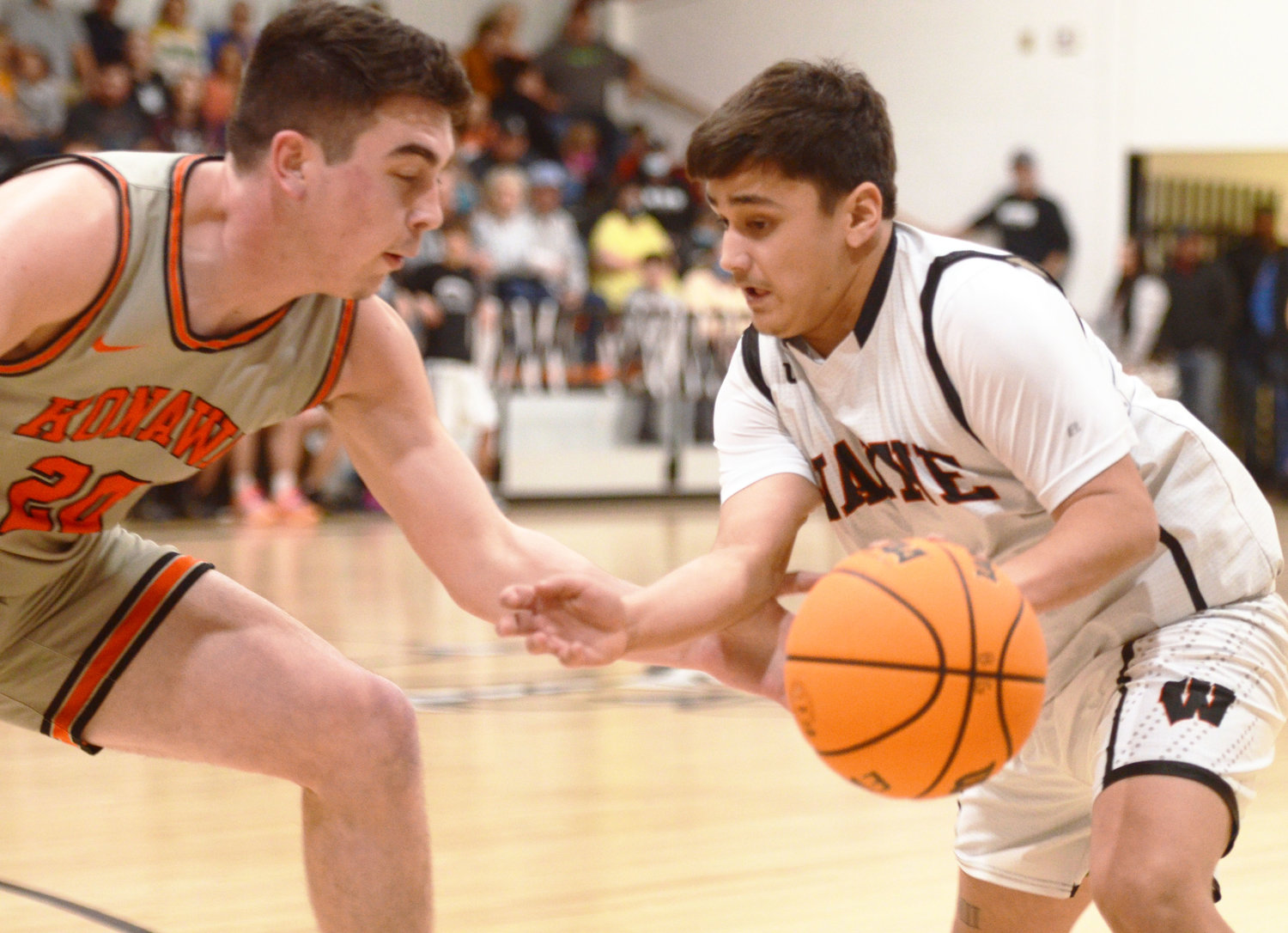 Wayne senior Jr. Perez finds an opening against the Konawa defense Friday night. Wayne defeated the Tigers 54-42. Perez scored four points in the game.