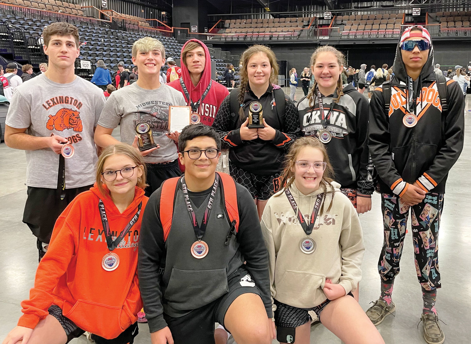 Medalists in the Midwestern Conference Wrestling Tournament last weekend are, top, from left, Brady Rillema, Izzy Pack, Tristan Buchanan, Cilee Turner, Elexa Collins and Cash Sessions. Bottom row - Hope Grove, Issac Martin and Bailie Forbes.
