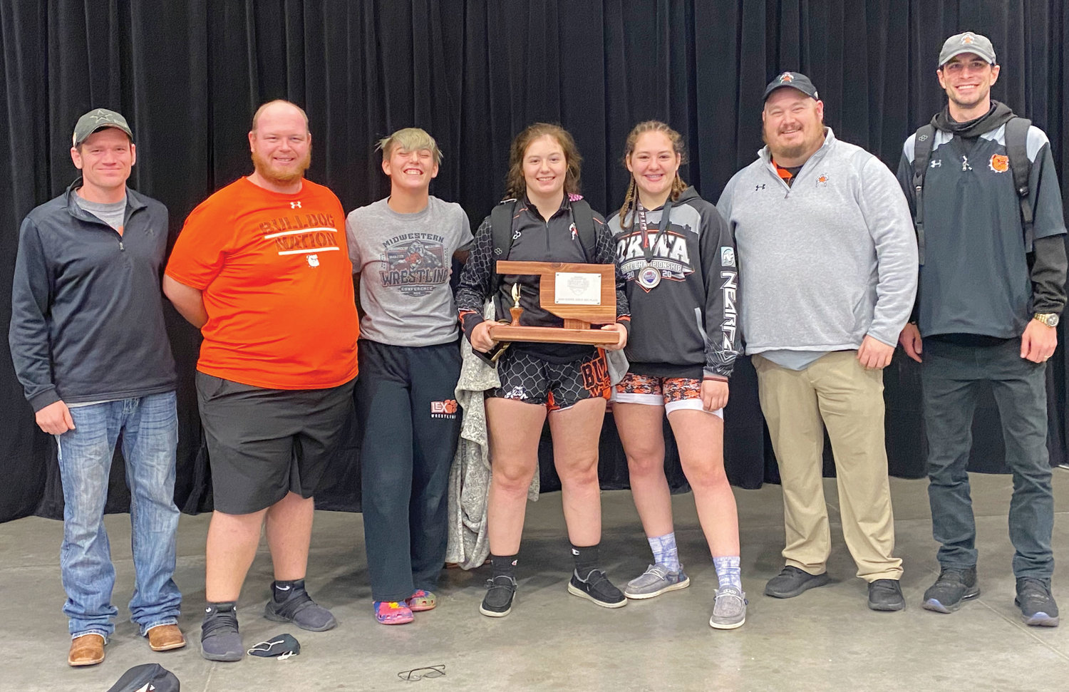 With the third place trophy for the girls division of the Midwestern Conference Tournament last weekend are, from left, Coach Buchanan, Coach Somers, Izzy Pack, Cilee Turner, Elexa Collins, Coach Garrett and Coach McKay.