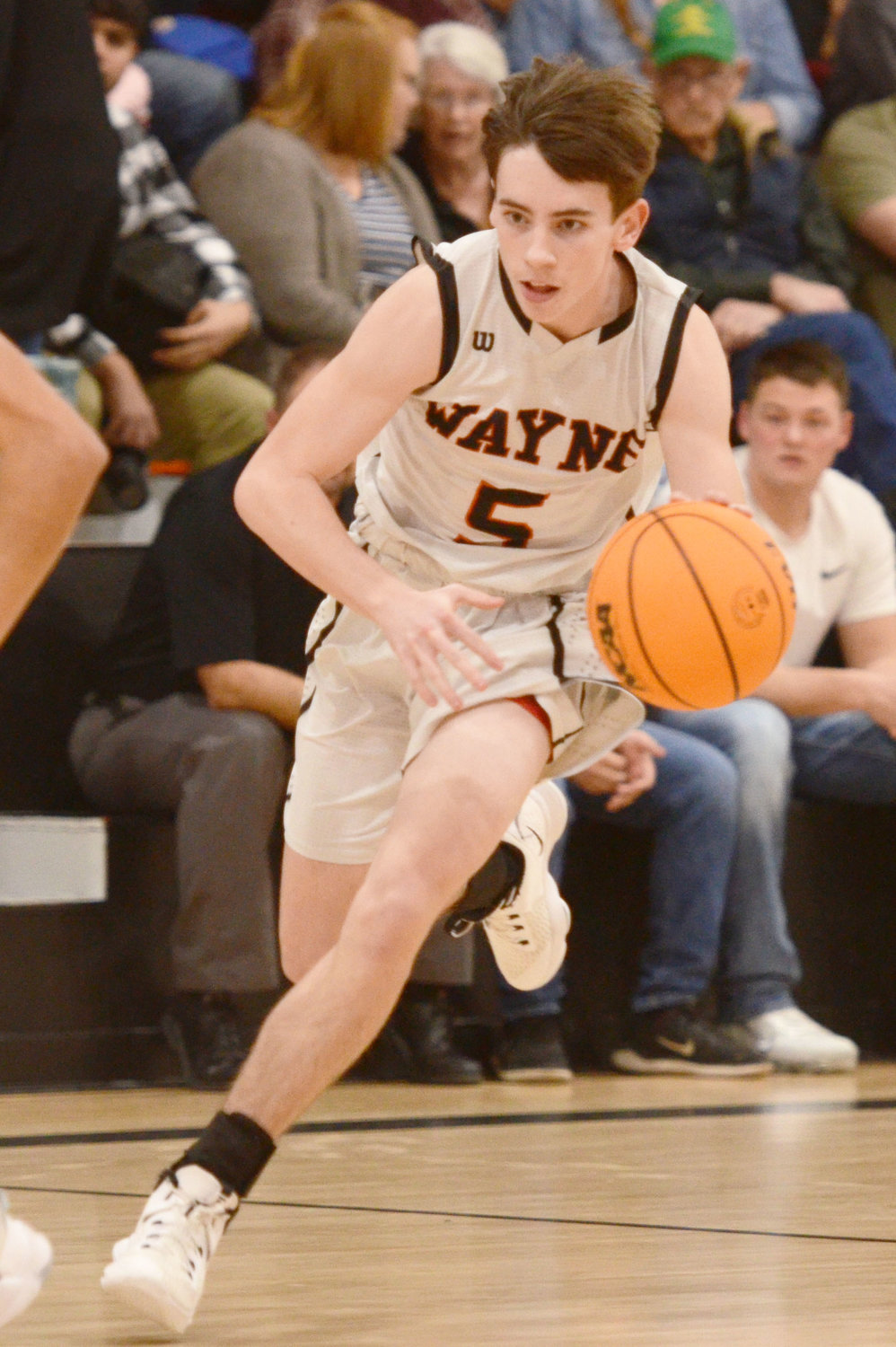 Wayne junior Kaleb Madden pushes the ball up the floor. The Bulldogs host Binger-Oney Friday night to open the District tournament.