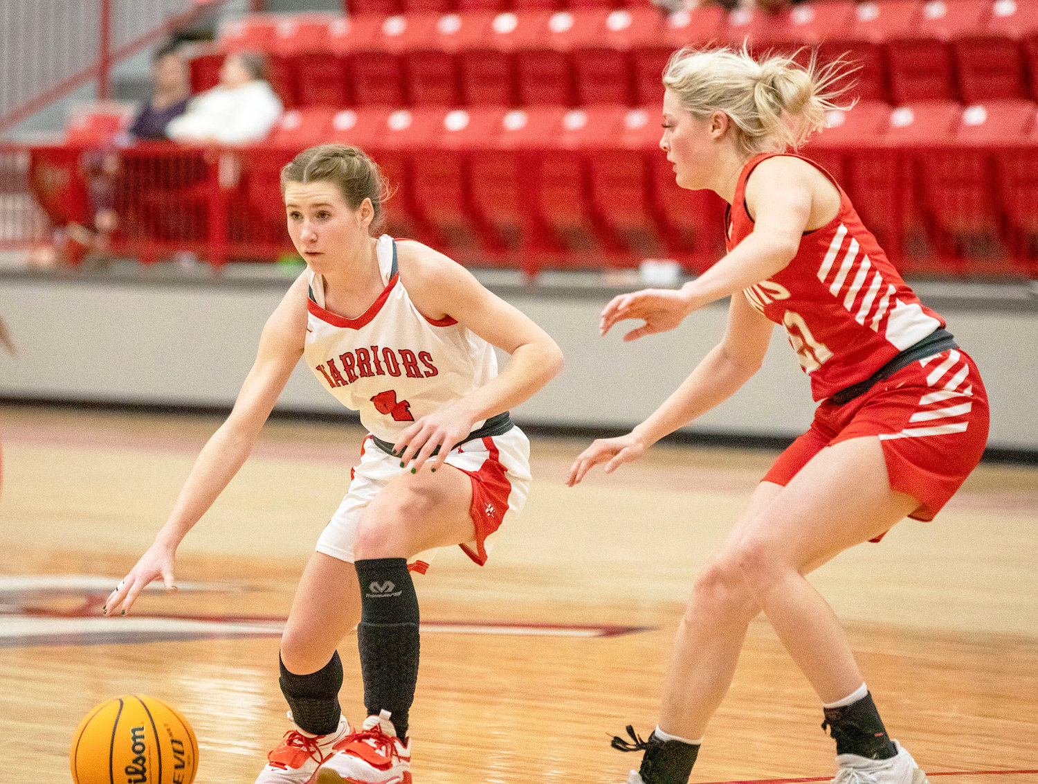 Washington freshman Rielyn Scheffe handles the ball for the Warriors against Davis. Washington was defeated 34-32. Washington plays Chisholm Saturday at 6:30 p.m. in the District tournament.