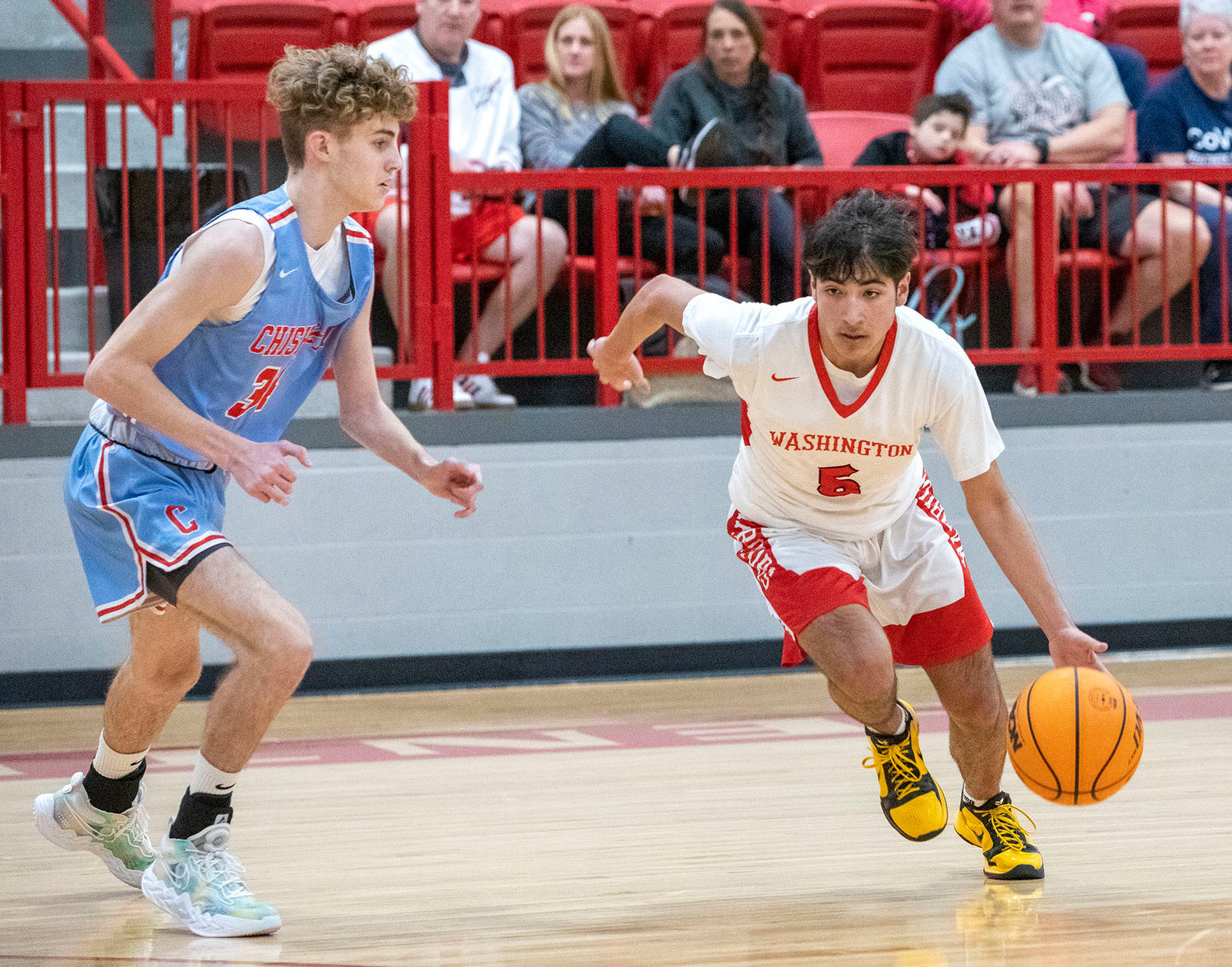 Washington senior Tony Trejo drives the ball into the lane during the Warriors’ 75-43 win over Chisholm in the District tournament. Trejo scored a team-high 14 points. Washington plays Perry at 7 p.m. Friday in the Regional tournament in Perry.
