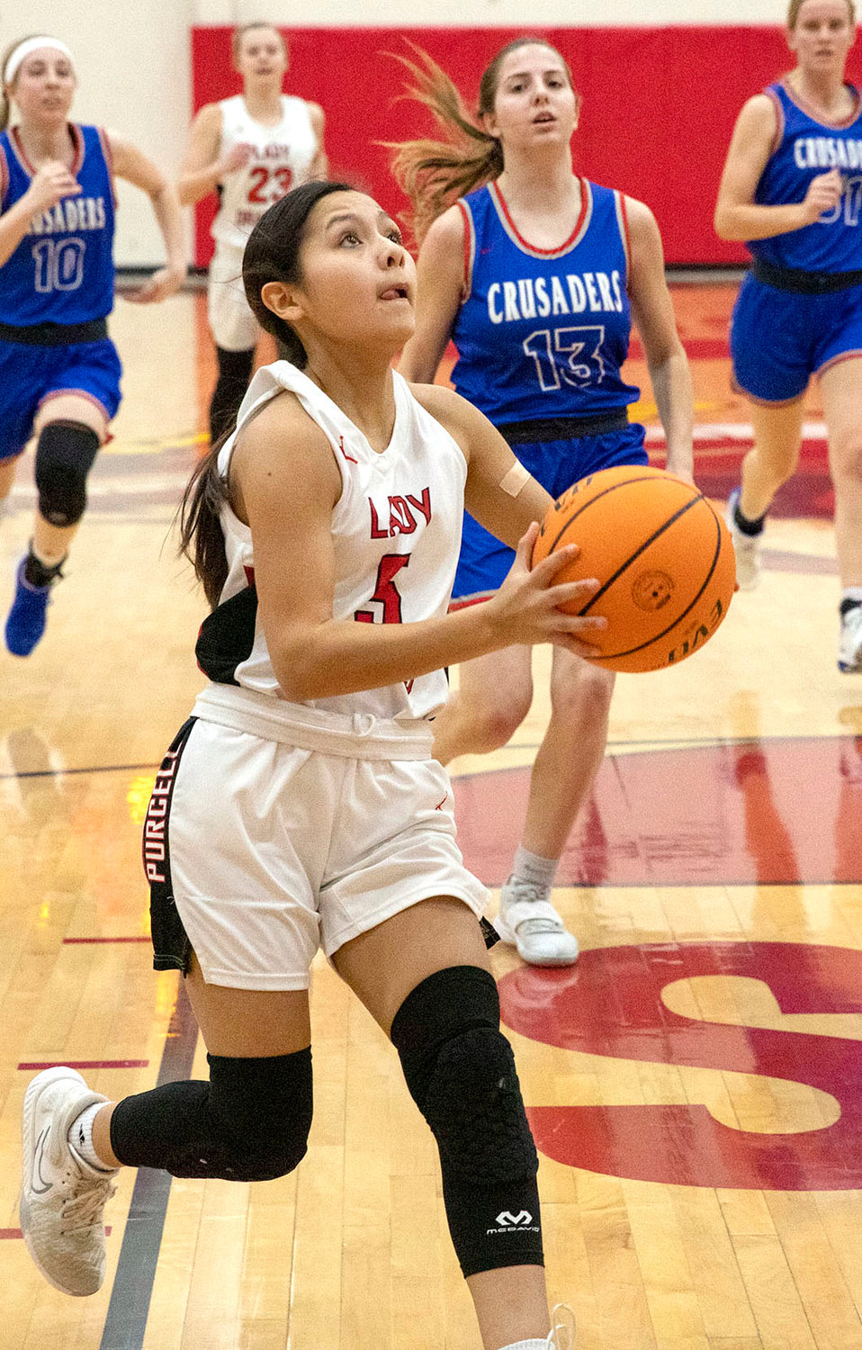 Purcell freshman Kenna Esparza moves in for a layup during the Dragons’ 57-40 win over Christian Heritage Academy in the Distict tournament. Esparza scored 10 points.